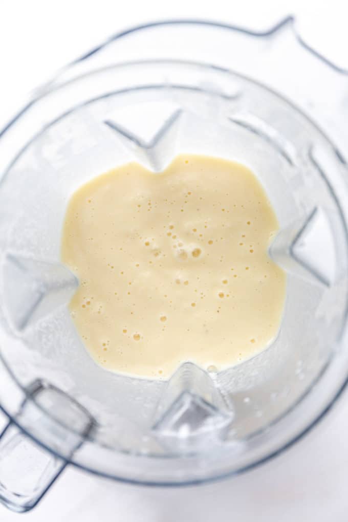 pina colada smoothie in a blender container